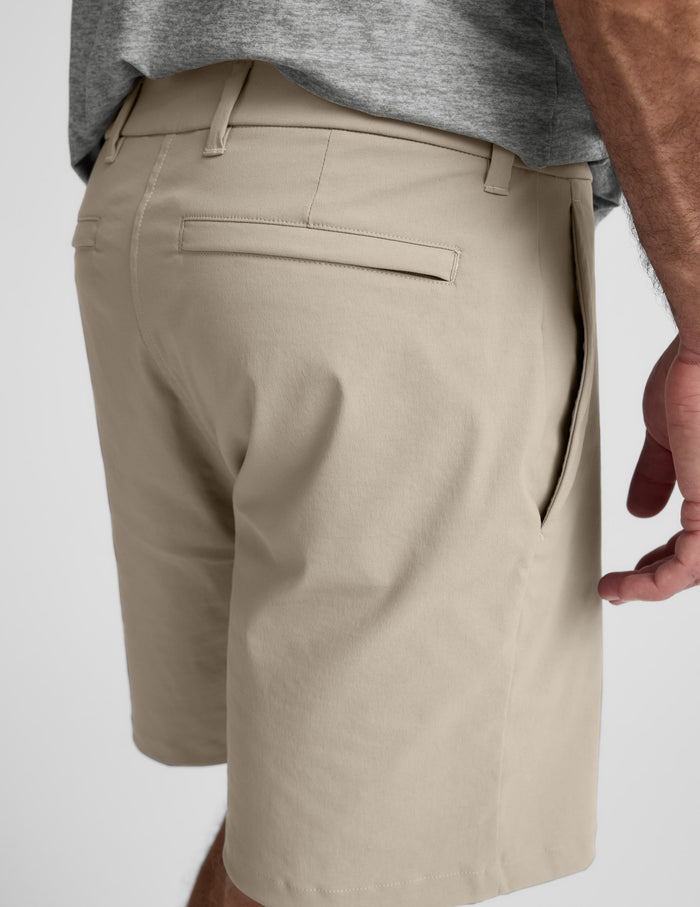 Side-back view of beige Element Men's Chino Short 7" featuring belt loops, a welt back pocket, and a side seam pocket.