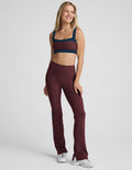 Maroon Spacedye Gemini Colorblock Side Slit Pant with white side panels and flared bootcut legs featuring ankle slits.