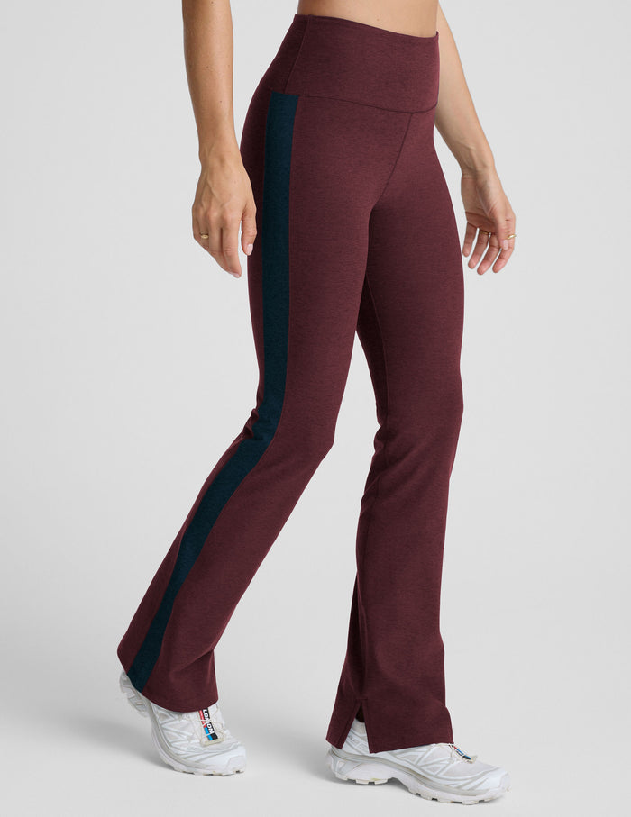 Maroon Spacedye Gemini Colorblock Side Slit Pant with white side stripes, wide waistband, and bootcut flared hem with slit.