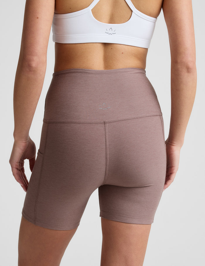 Rear view of Spacedye Keep Pace 5" Pocket Short in blush marled fabric, featuring a high waistband and side pockets.