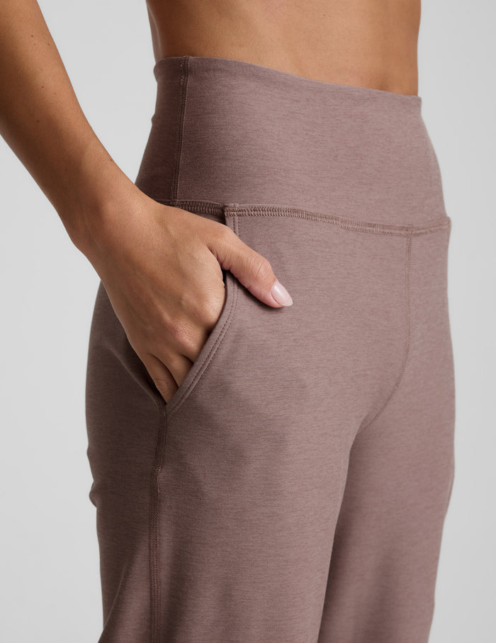 Close-up of blush Spacedye Laid Back Wide Leg Pant featuring a high waistband and hand resting in a side slant pocket.