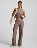 Woman modeling blush Spacedye Laid Back Wide Leg Pant 31" with a high waistband, side pockets, and relaxed, full-length fit.