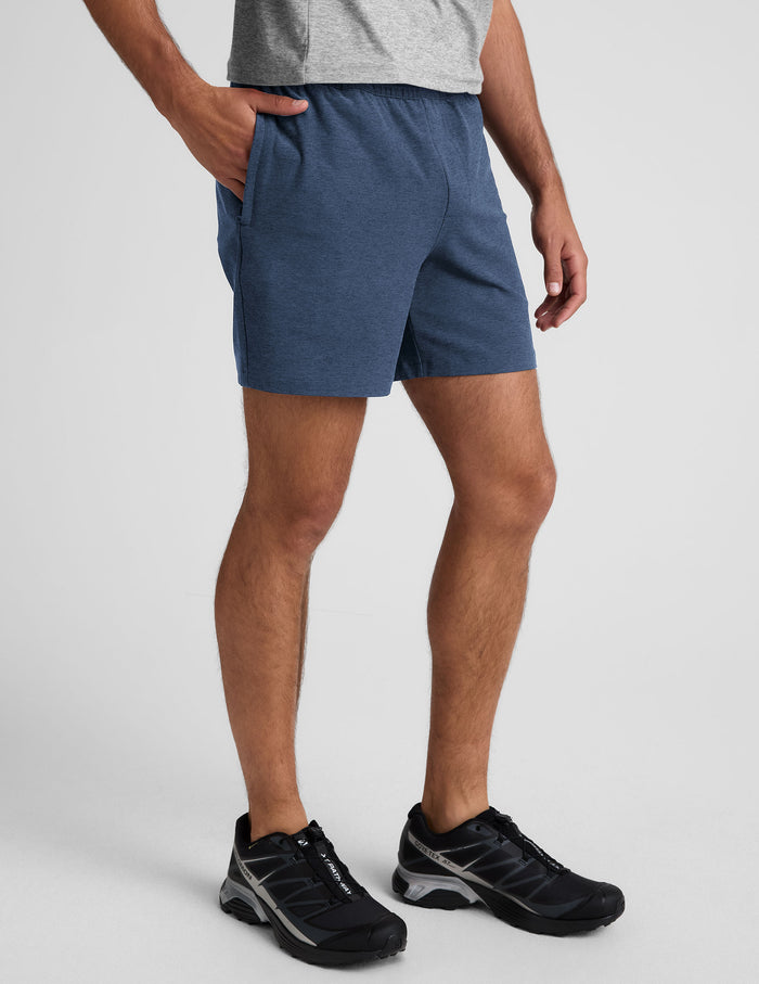 Blue marled Spacedye Unlimited Men's Short with an elastic waistband and pockets, shown in a side profile on a model.